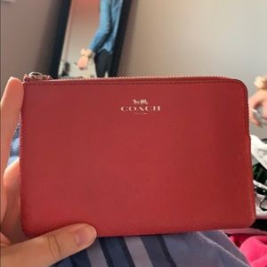 Hot Pink Coach wristlet.